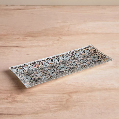 Decorative rectangular plate with floral pattern on a wooden surface