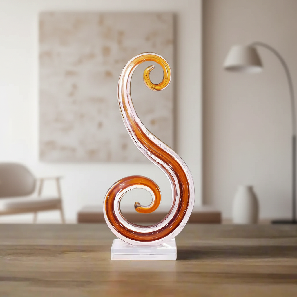 Decorative swirl sculpture on a wooden surface with a blurred indoor background