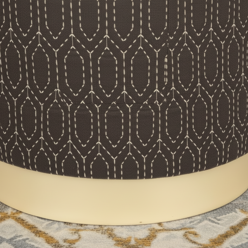 Close-up of a dark brown fabric with a geometric pattern and beige base.
