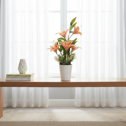 Artificial flower arrangement in a white pot on a gray background