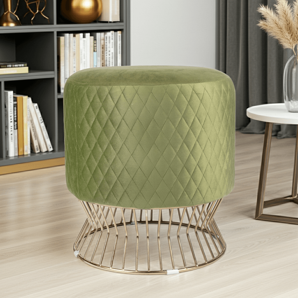 Green quilted stool with gold wire base in a room setting