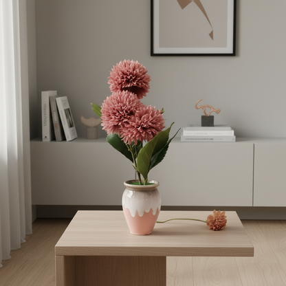 Pink flower arrangement in a vase on a wooden table with a neutral background
