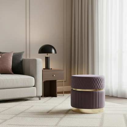 Modern living room with a gray sofa, side table, and decorative stool.