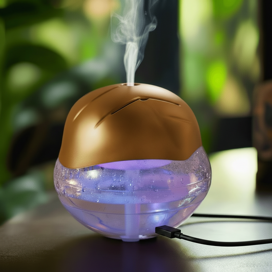 Gold and clear humidifier emitting mist with a blurred green background