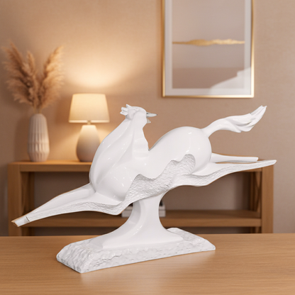 Decorative white sculpture of two birds on a branch in a home setting.