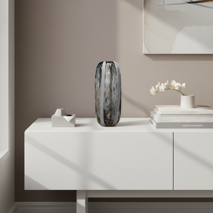 Modern interior with a white cabinet, decorative vase, and books against a beige wall.