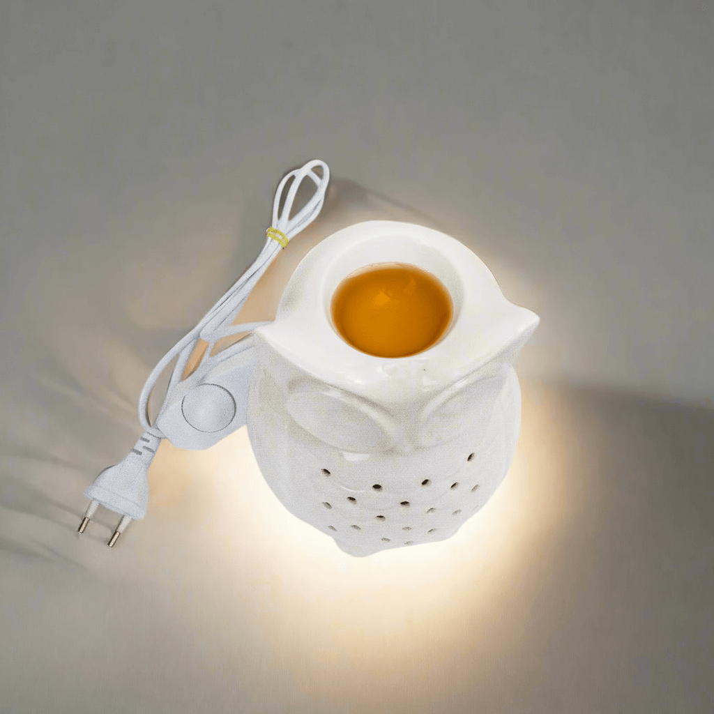 White night light with owl design on a gray background