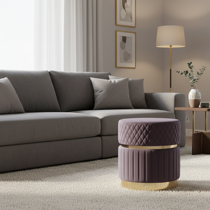 Gray sectional sofa in a living room with a decorative purple ottoman.
