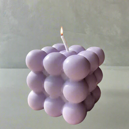 Cube-shaped soy wax candle with purple bubbles