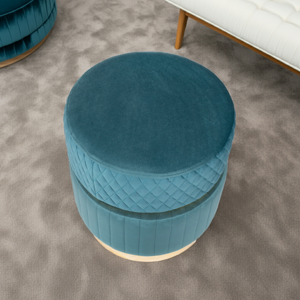 Blue round ottoman with quilted design on a white background