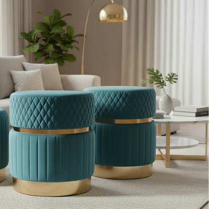 Two teal ottomans with gold accents in a living room setting.