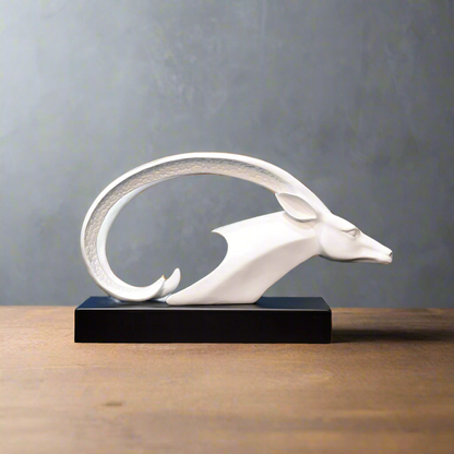 White dragon sculpture on a black base against a wooden paneled wall.
