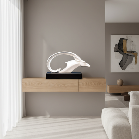 Modern living room with a dolphin sculpture on a wooden console table.